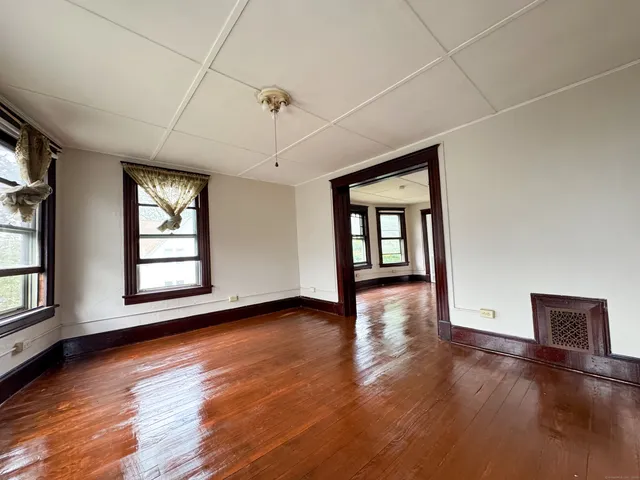 a view of a house with a yard and garden