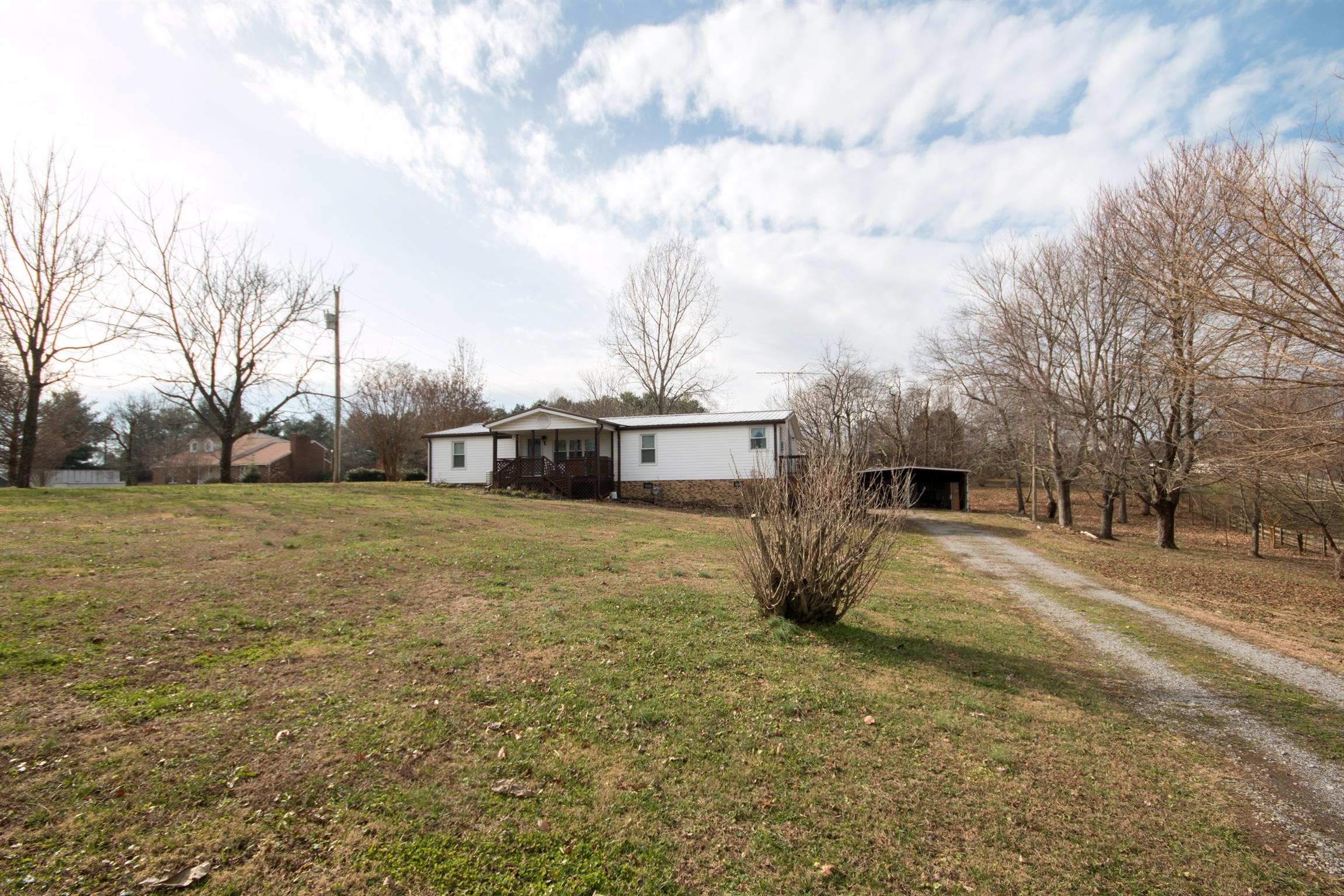 149 Mitchell Road Portland, TN 37148 - Photo 1 of 29 a view of open kitchen with large trees