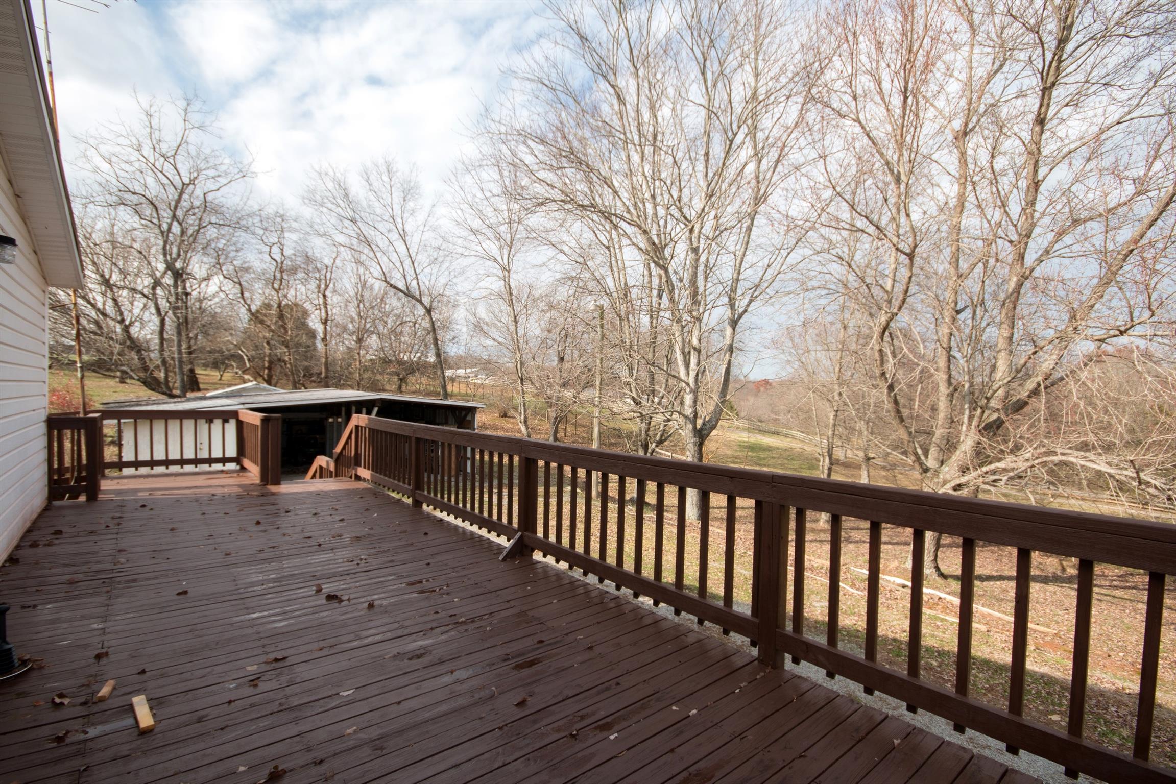 149 Mitchell Road Portland, TN 37148 - Photo 16 of 29 a balcony with wooden floor and fence