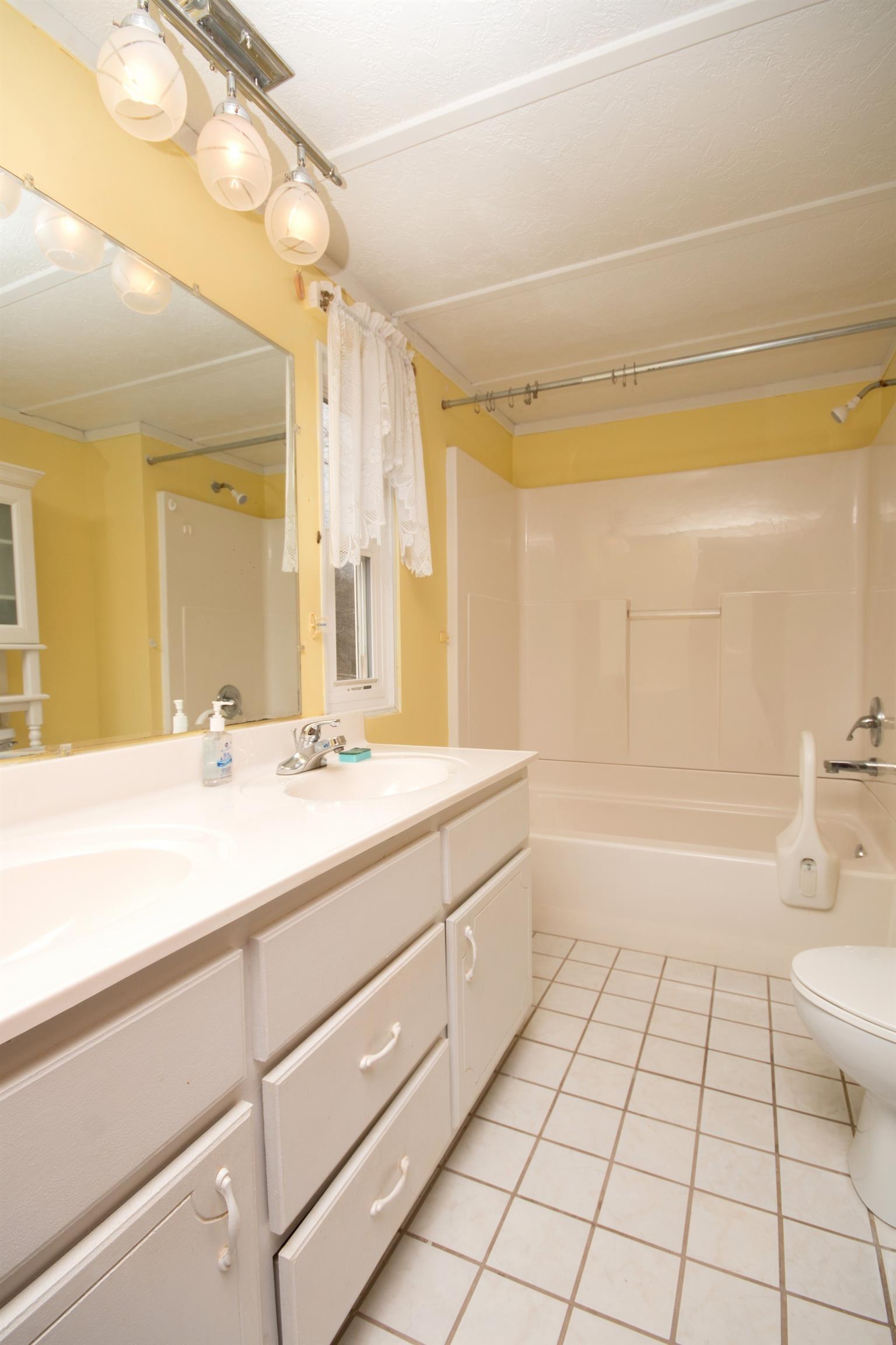 149 Mitchell Road Portland, TN 37148 - Photo 28 of 29 a bathroom with a sink a toilet and shower