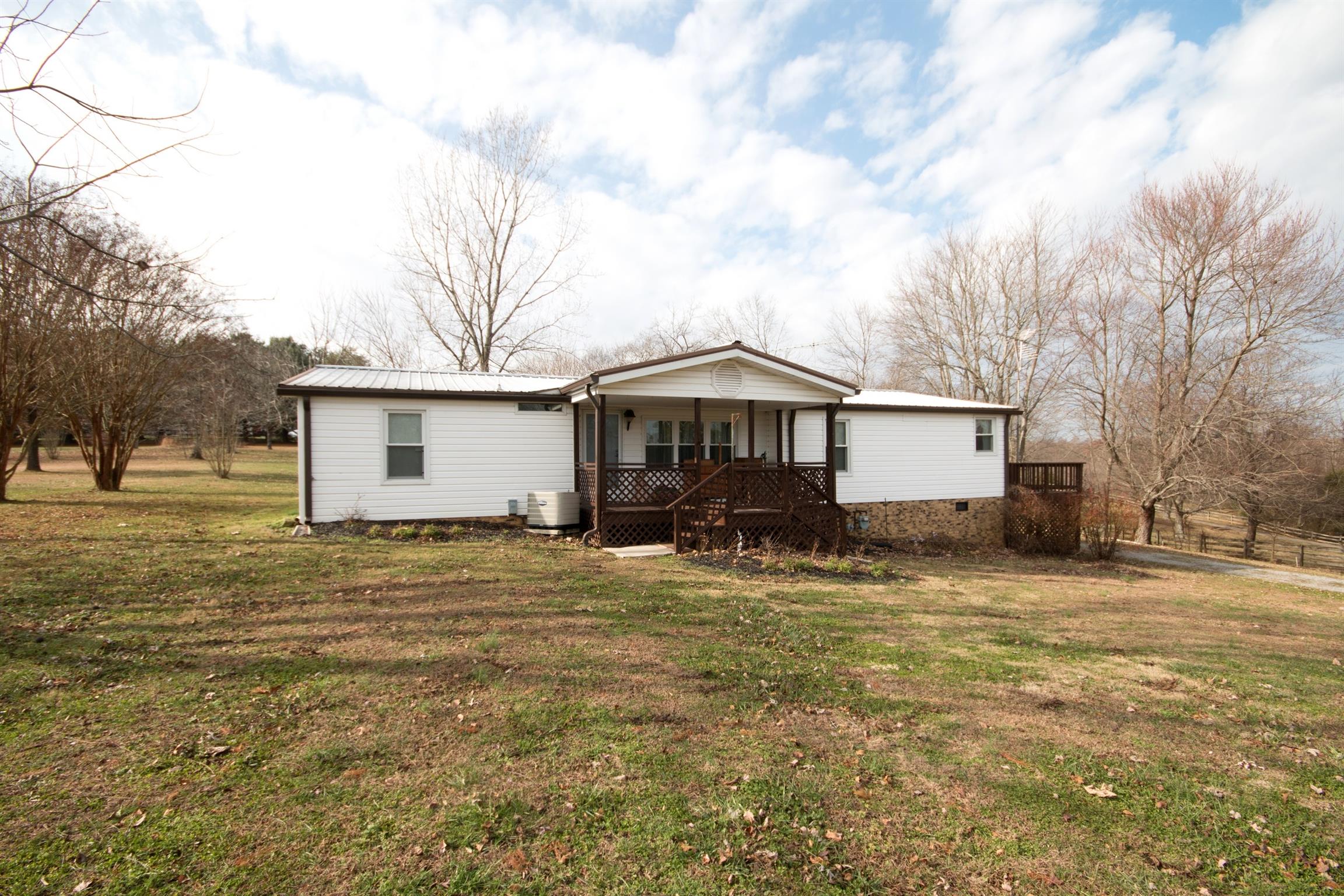149 Mitchell Road Portland, TN 37148 - Photo 4 of 29 a view of a house with a yard covered with snow