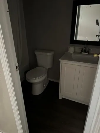 a bathroom with a toilet and a sink