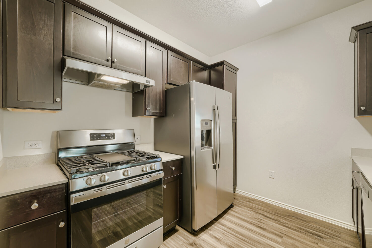 7001 Tonka Lane Austin, TX 78744 - Photo 13 of 30 a kitchen with stainless steel appliances granite countertop a refrigerator and a stove