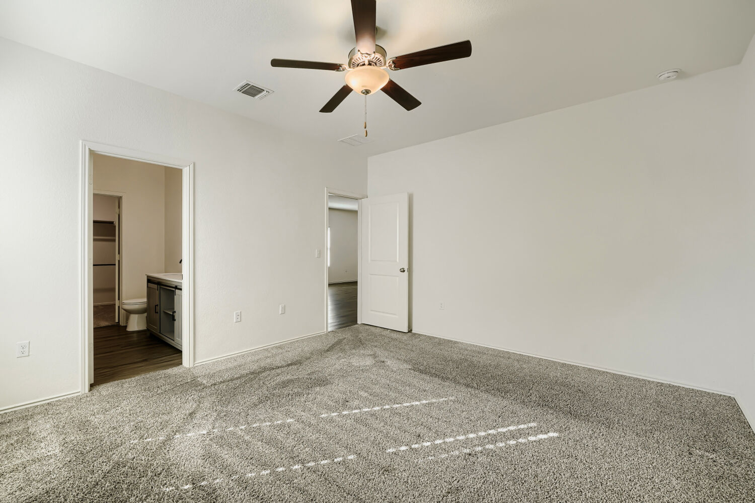 7001 Tonka Lane Austin, TX 78744 - Photo 15 of 30 a view of a livingroom with a ceiling fan and kitchen space