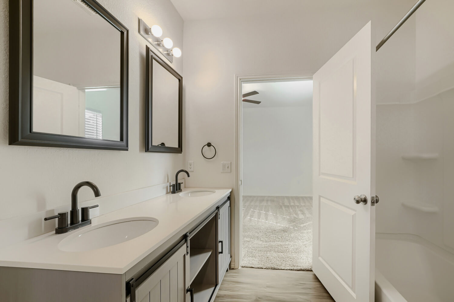 7001 Tonka Lane Austin, TX 78744 - Photo 18 of 30 a bathroom with double sink and two mirror