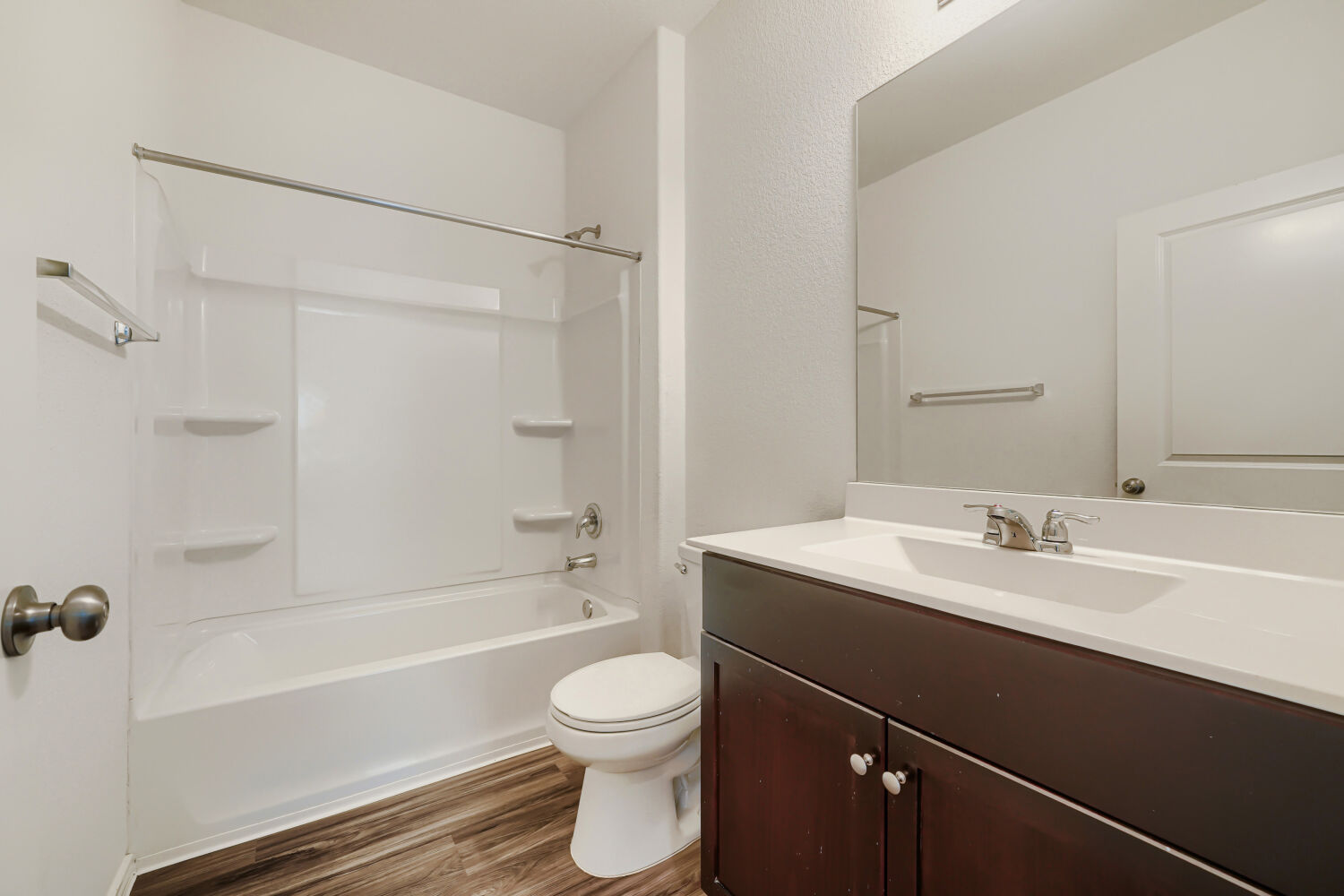 7001 Tonka Lane Austin, TX 78744 - Photo 23 of 30 a bathroom with a sink a toilet a mirror and shower