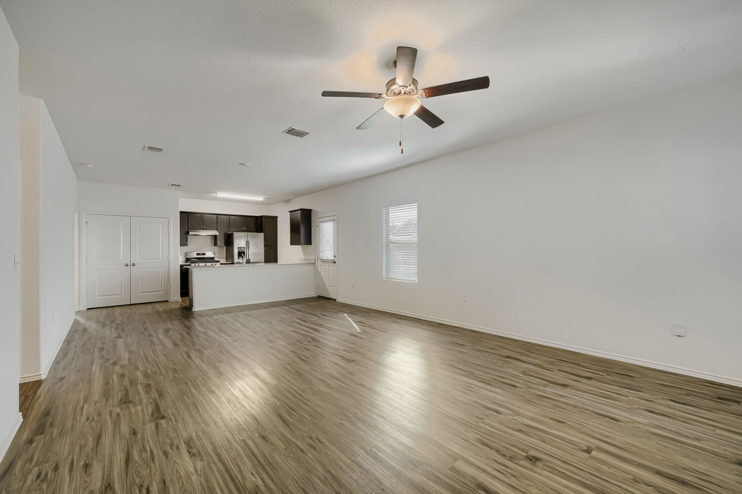 7001 Tonka Lane Austin, TX 78744 - Photo 4 of 30 wooden floor in an empty room