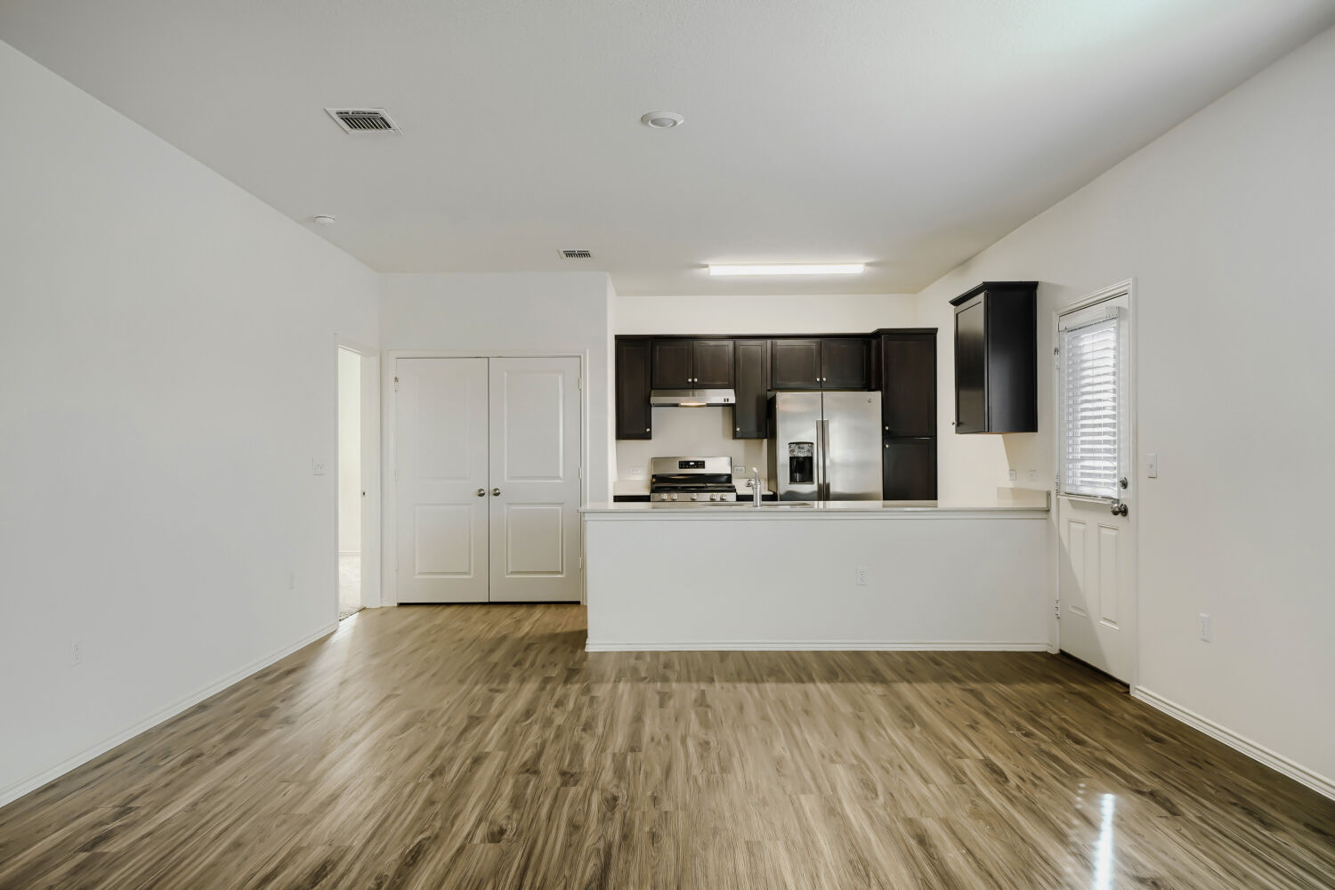 7001 Tonka Lane Austin, TX 78744 - Photo 6 of 30 a view of kitchen with wooden floor