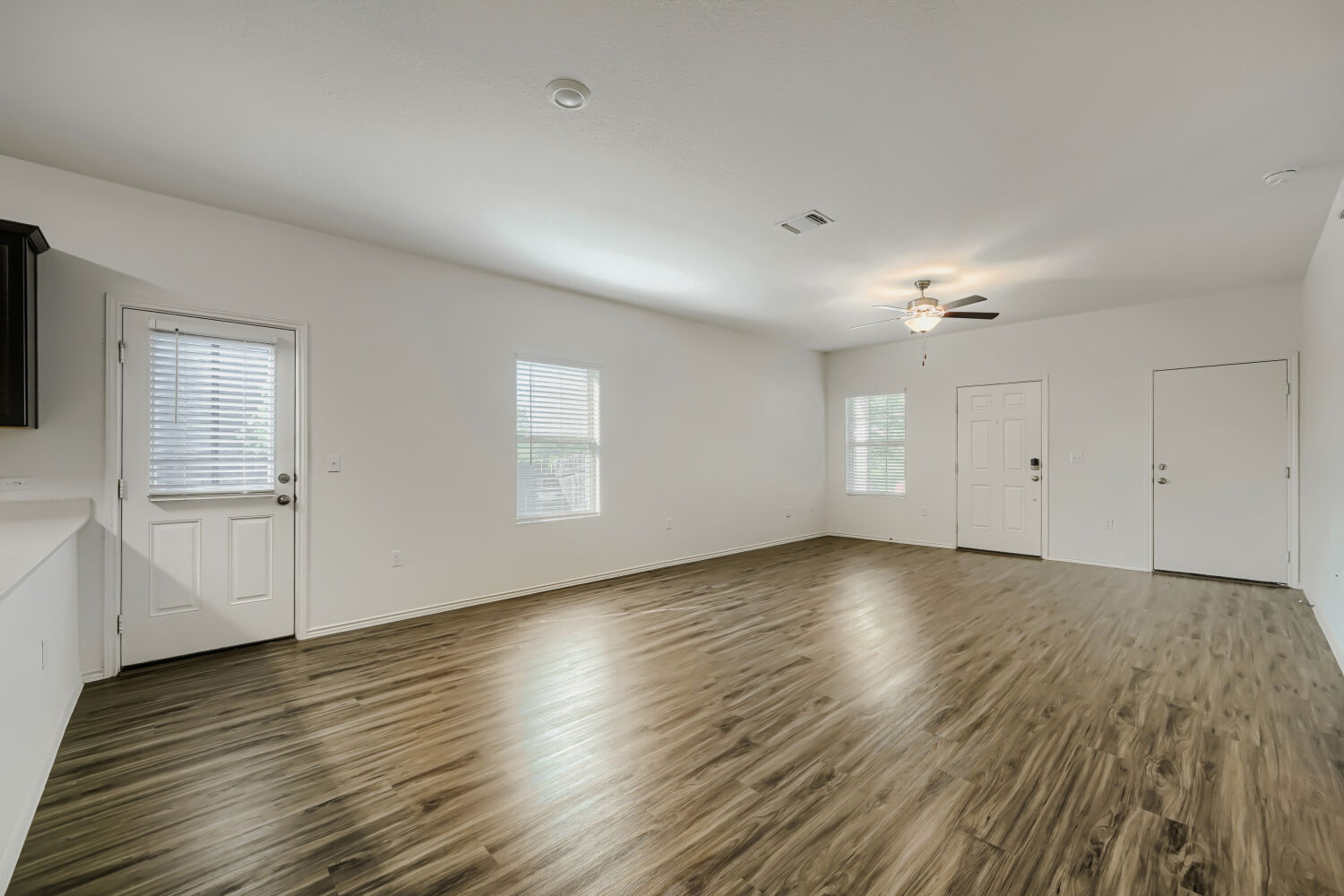 7001 Tonka Lane Austin, TX 78744 - Photo 7 of 30 an empty room with wooden floor
