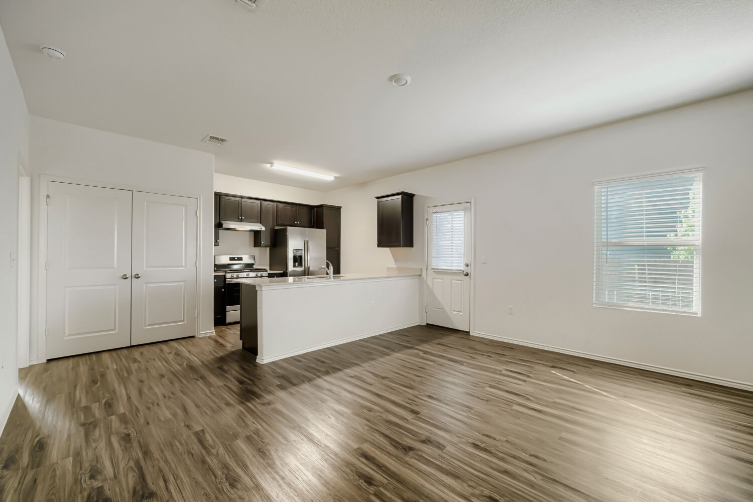 7001 Tonka Lane Austin, TX 78744 - Photo 8 of 30 a view of kitchen with wooden floor