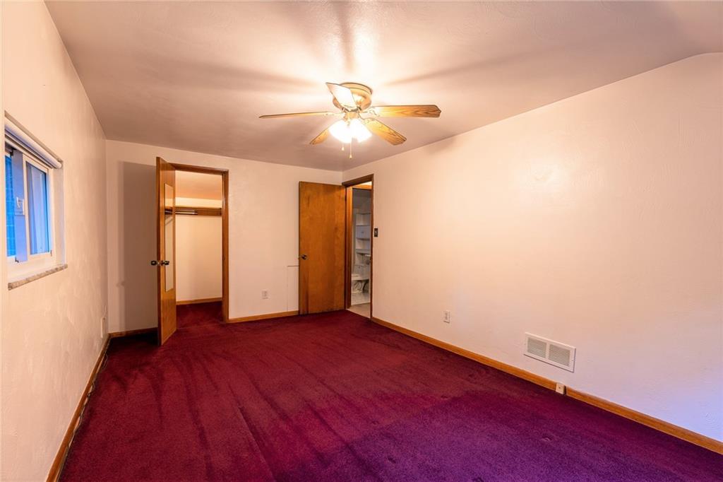 586 Filmore Road Pittsburgh, PA 15221 - Photo 16 of 25 wooden floor in an empty room with a window