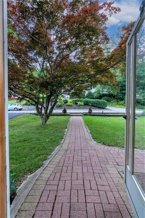 586 Filmore Road Pittsburgh, PA 15221 - Photo 2 of 25 a view of a park with large trees