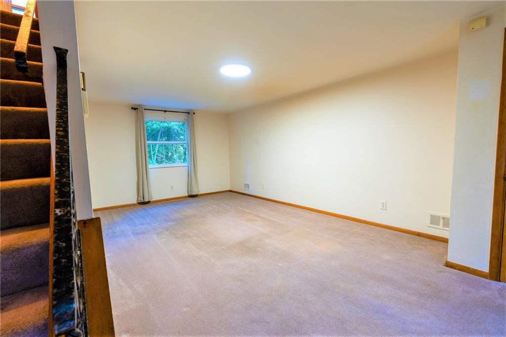 586 Filmore Road Pittsburgh, PA 15221 - Photo 6 of 25 an empty room with windows