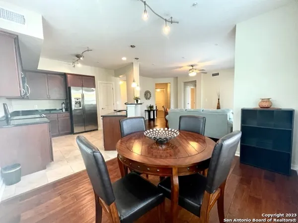 a view of a dining room with furniture and wooden floor