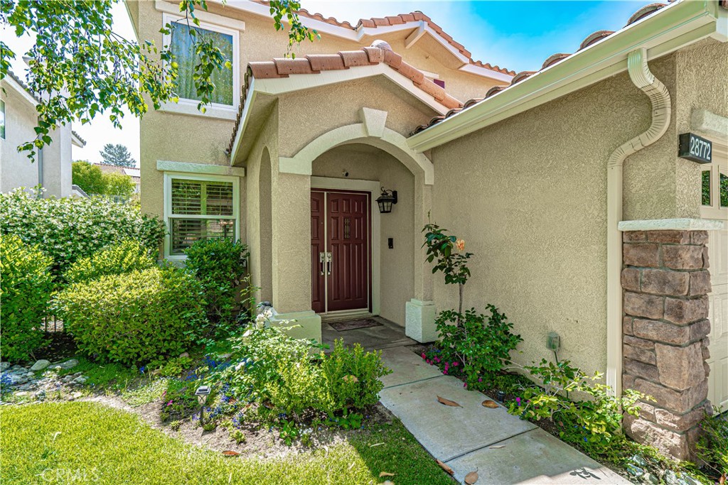28772 Woodside Drive Saugus, CA 91390 - Photo 2 of 23 a front view of a house with plants