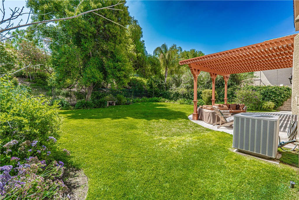 28772 Woodside Drive Saugus, CA 91390 - Photo 22 of 23 a view of a house with backyard and sitting area