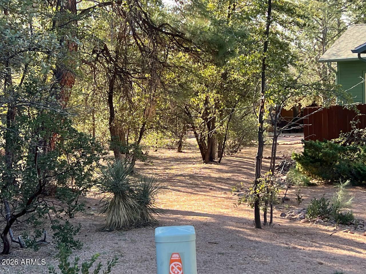 821 Eagle Ridge Circle Payson, AZ 85541 - Photo 2 of 7 a view of a yard with large trees