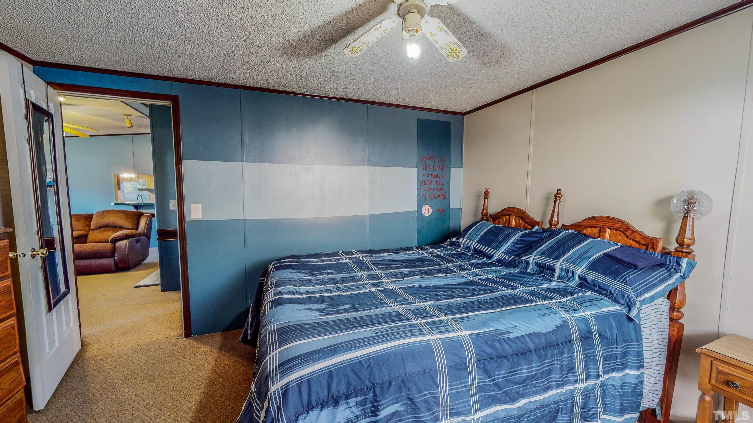 200 David Lane Roxboro, NC 27573 - Photo 25 of 38 a bedroom with a bed and a mirror