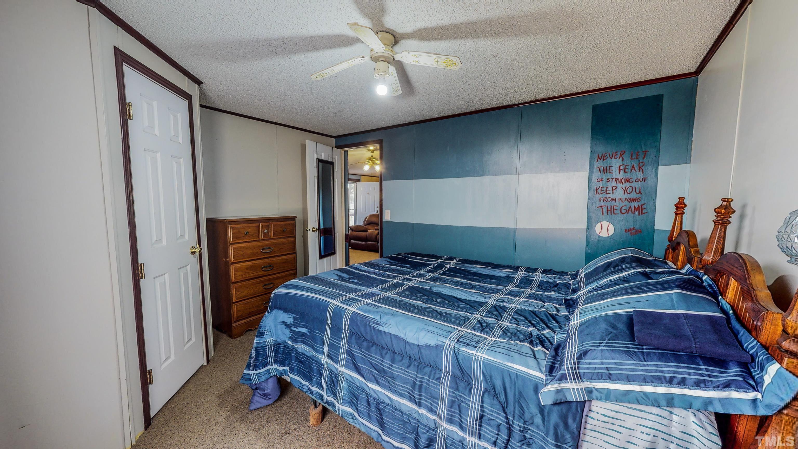 200 David Lane Roxboro, NC 27573 - Photo 26 of 38 a bedroom with a bed and a mirror