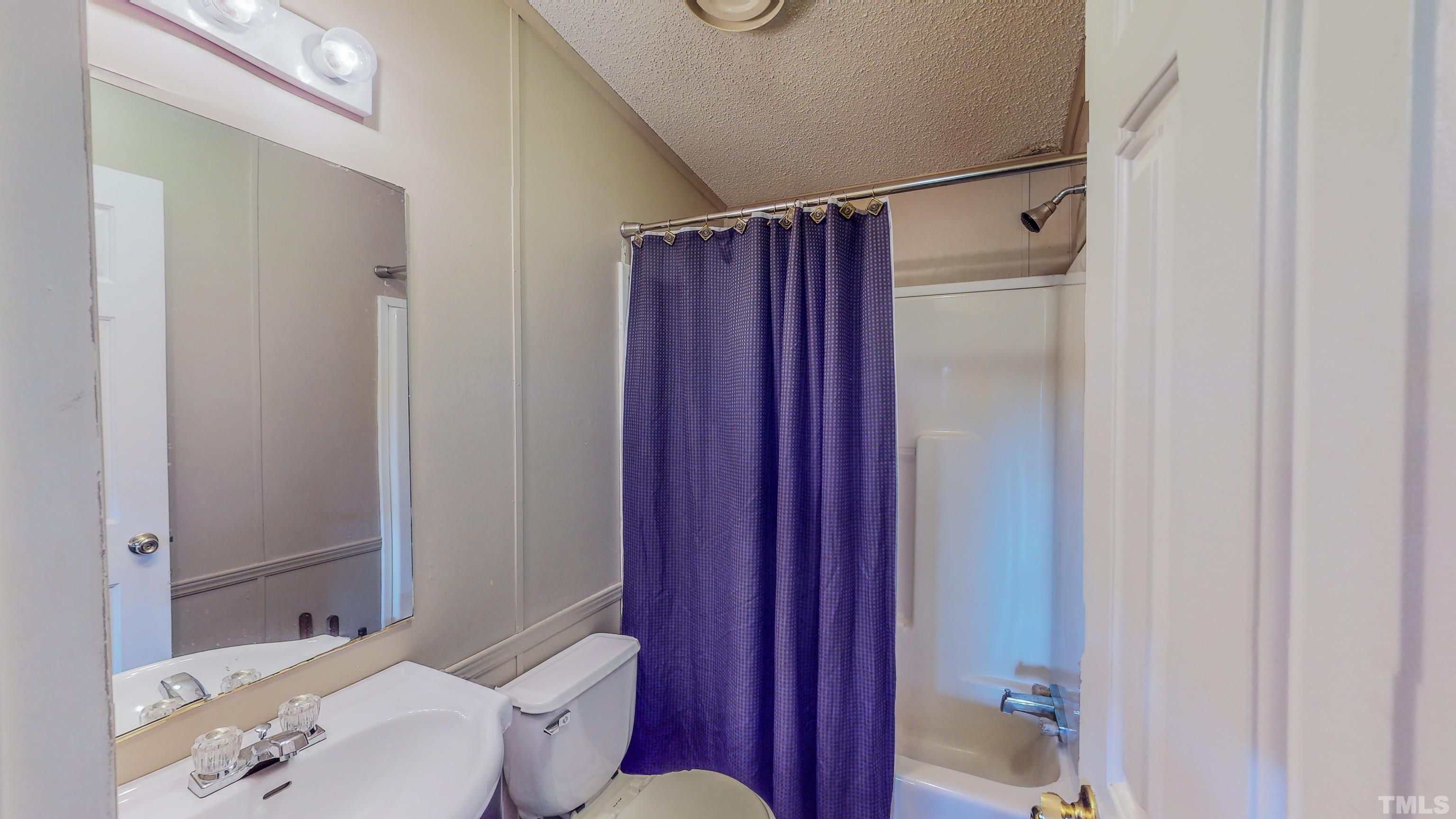 200 David Lane Roxboro, NC 27573 - Photo 28 of 38 a bathroom with a sink toilet and shower