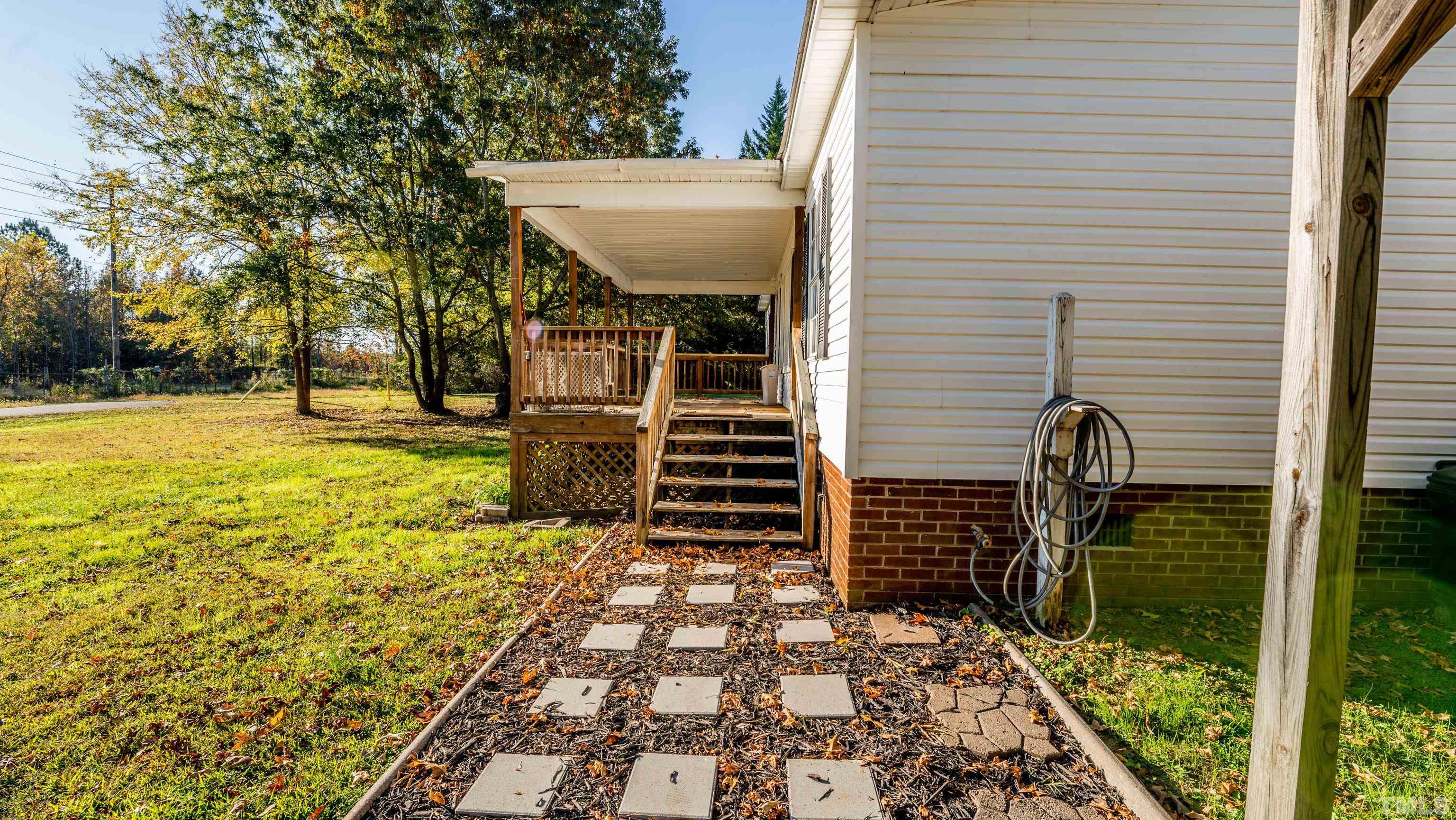 200 David Lane Roxboro, NC 27573 - Photo 31 of 38 a view of a pathway of a house with backyard