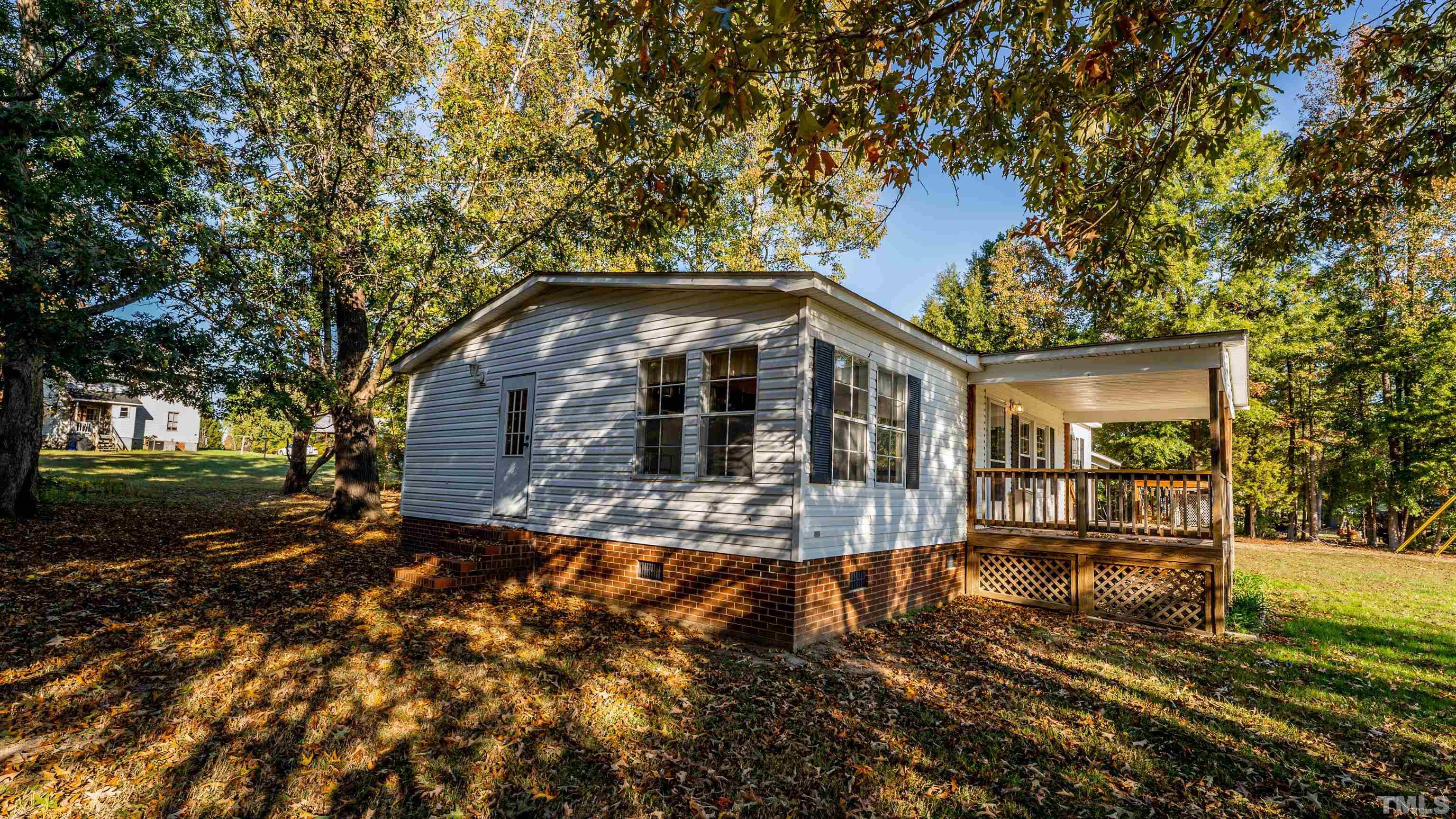 200 David Lane Roxboro, NC 27573 - Photo 36 of 38 a front view of a house with a yard