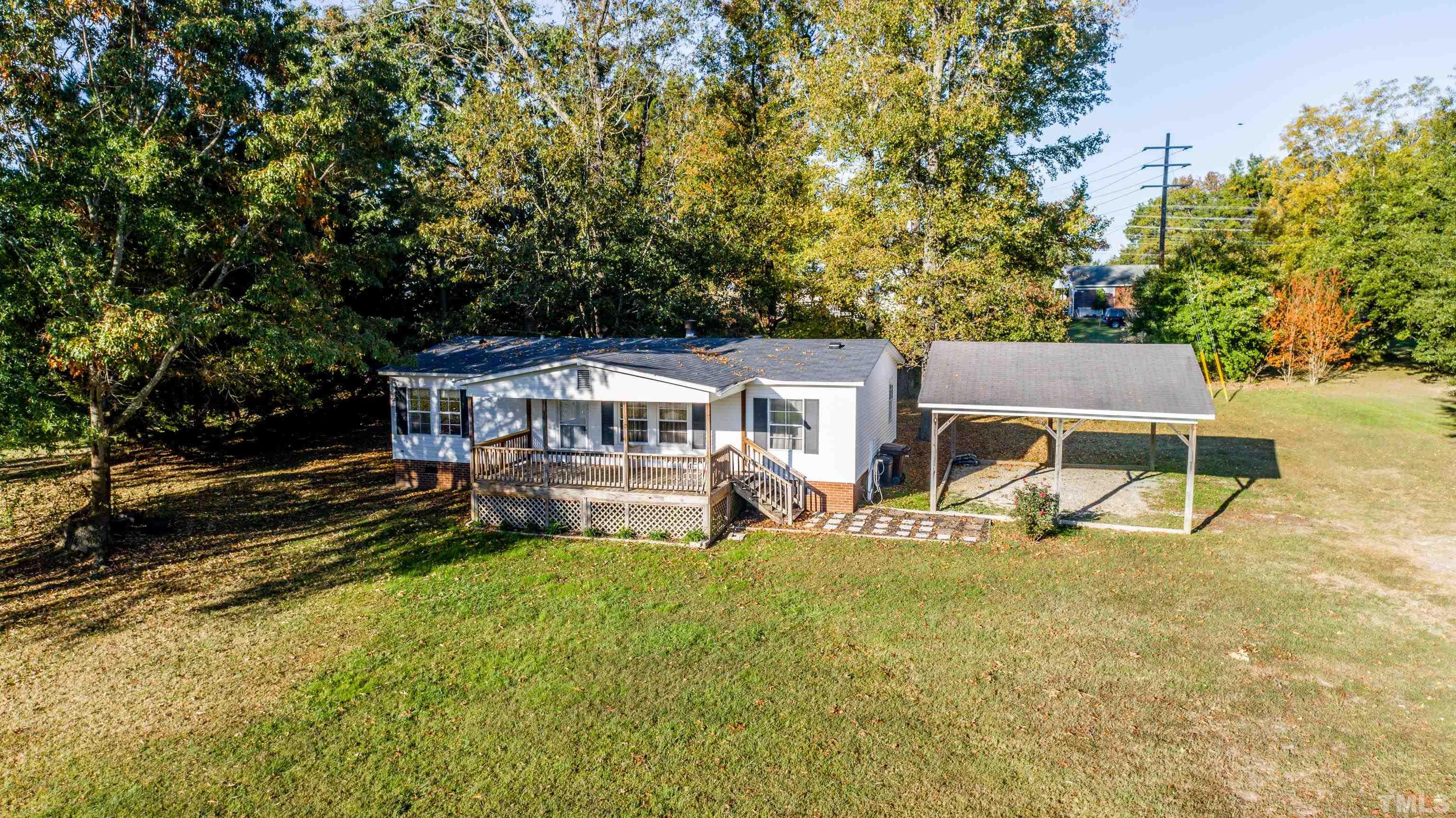 200 David Lane Roxboro, NC 27573 - Photo 8 of 38 a view of a house with backyard porch and sitting area