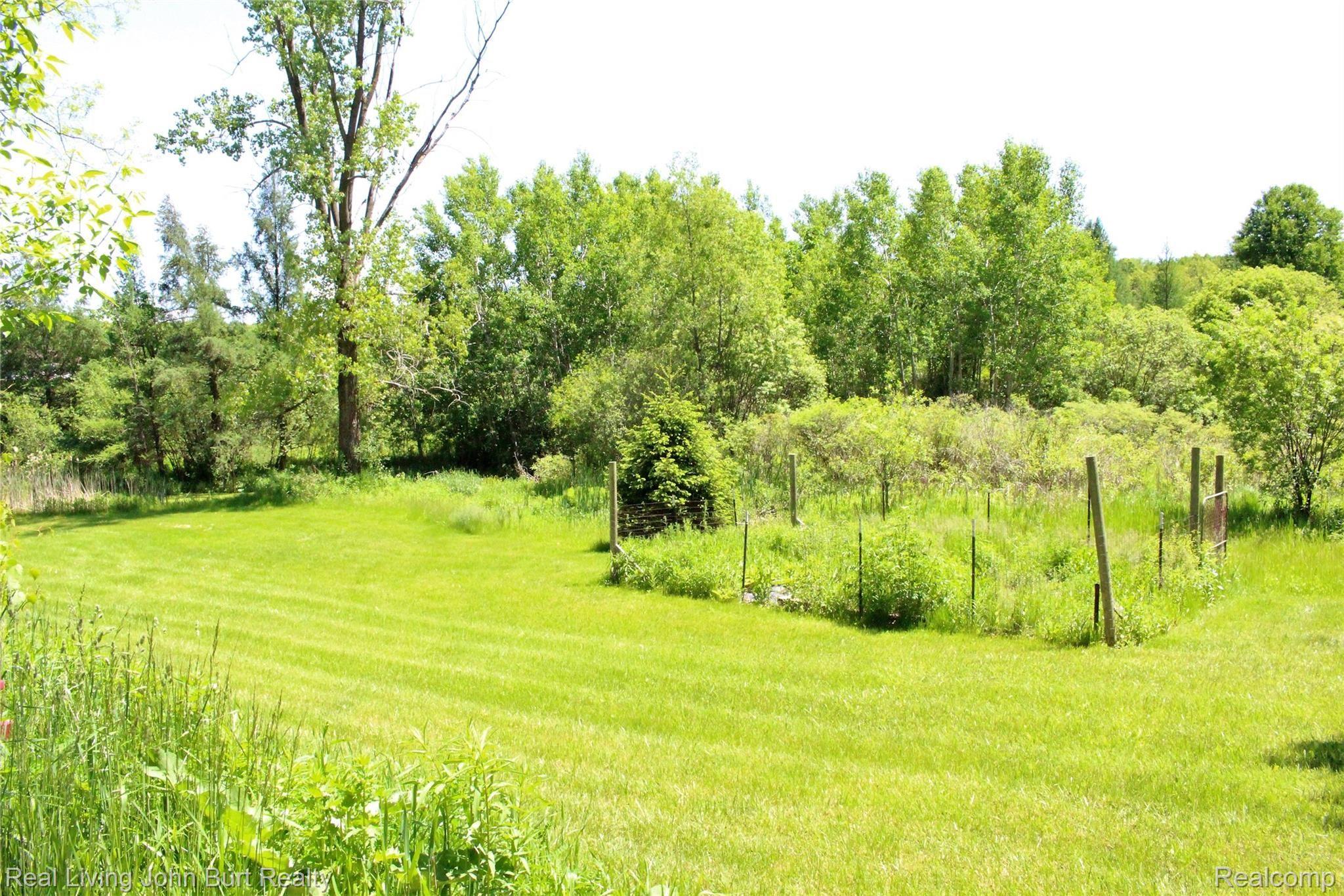 4965 Perryville Road Holly, MI 48442 - Photo 3 of 29 Pond to the far left and enclosed garden area