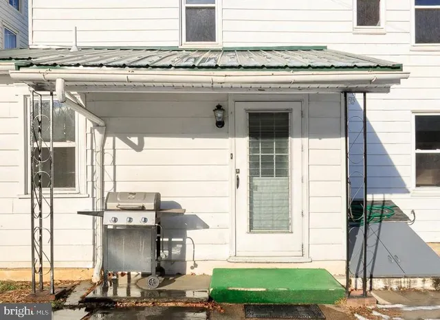a stove top oven sitting next to a window