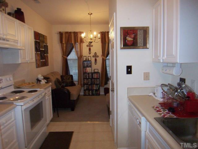 2000 Red Quartz Drive Raleigh, NC 27610 - Photo 5 of 10 a kitchen with stainless steel appliances granite countertop a stove a sink and a refrigerator