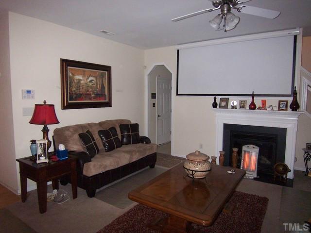 2000 Red Quartz Drive Raleigh, NC 27610 - Photo 6 of 10 a living room with furniture a table and a fireplace