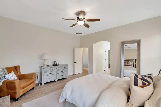 a bedroom with bed and window