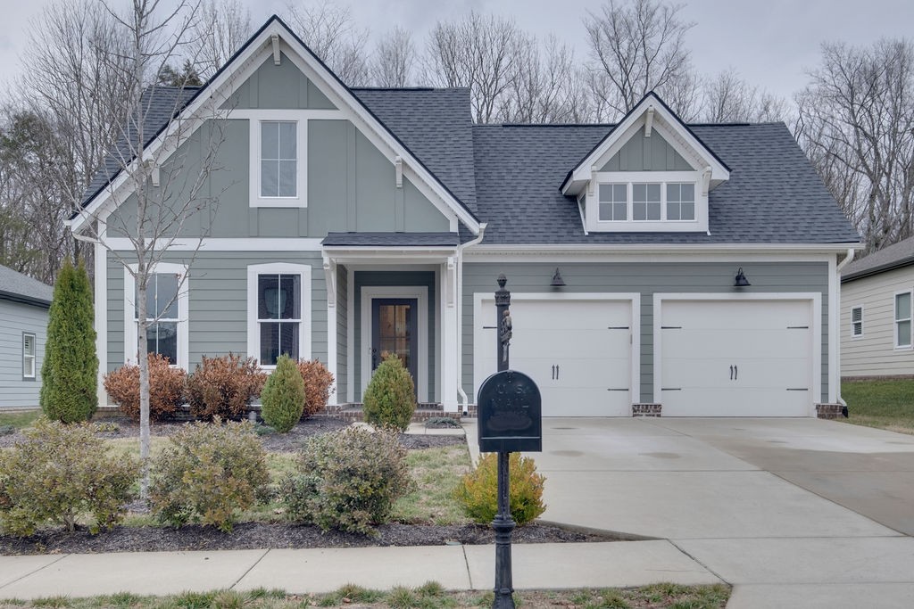 713 Plowson Road Mount Juliet, TN 37122 - Photo 1 of 33 a front view of a house with garden