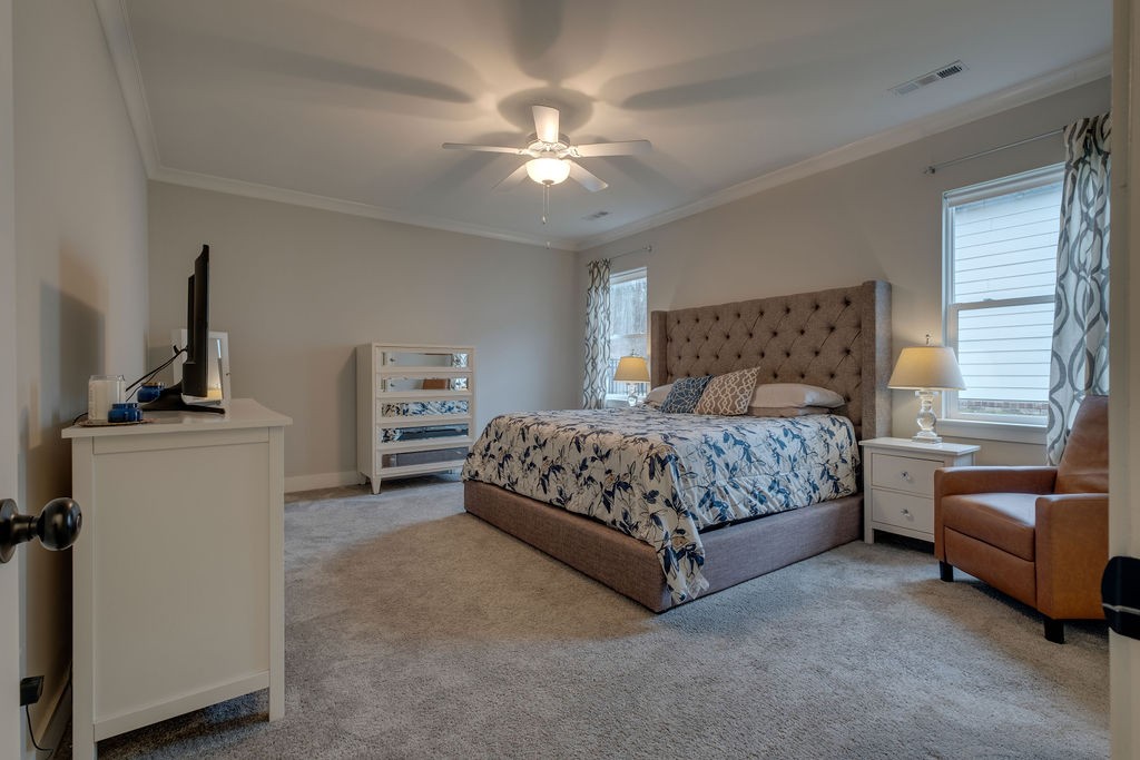 713 Plowson Road Mount Juliet, TN 37122 - Photo 17 of 33 a bedroom with a bed and a couch