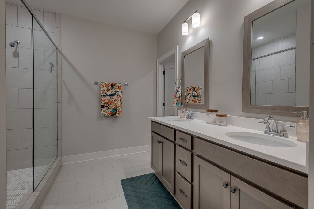 713 Plowson Road Mount Juliet, TN 37122 - Photo 20 of 33 a bathroom with a double vanity sink mirror and double