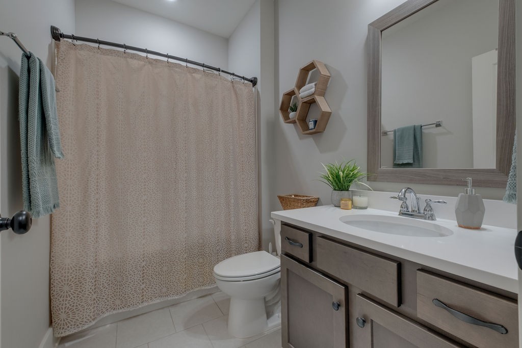 713 Plowson Road Mount Juliet, TN 37122 - Photo 26 of 33 a bathroom with a granite countertop sink vanity mirror and toilet