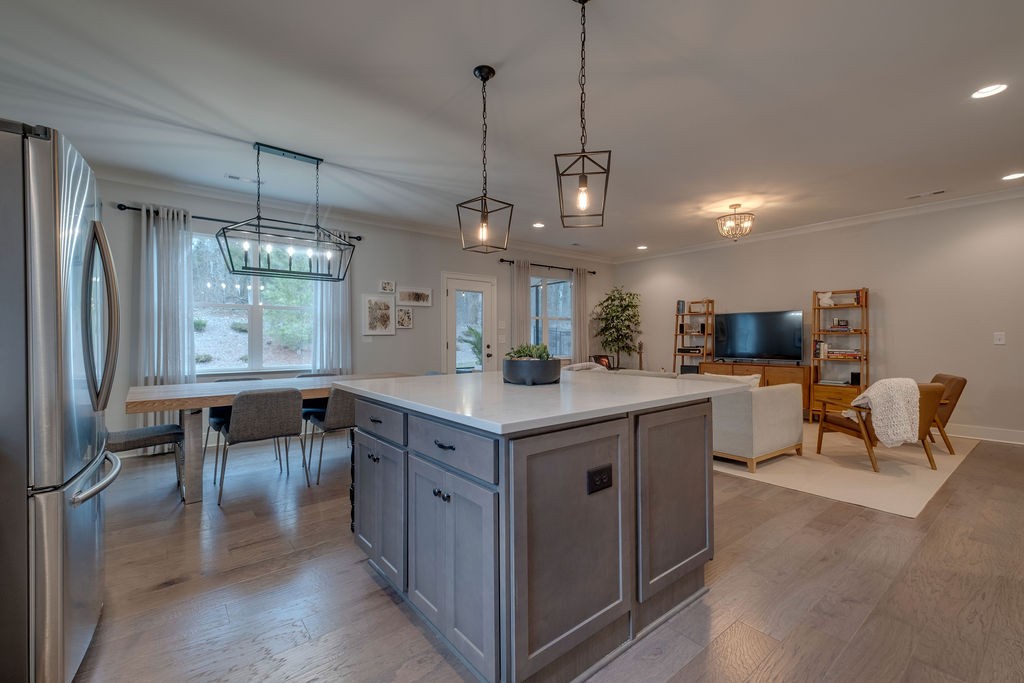 713 Plowson Road Mount Juliet, TN 37122 - Photo 10 of 33 a kitchen with a stove a refrigerator and chairs