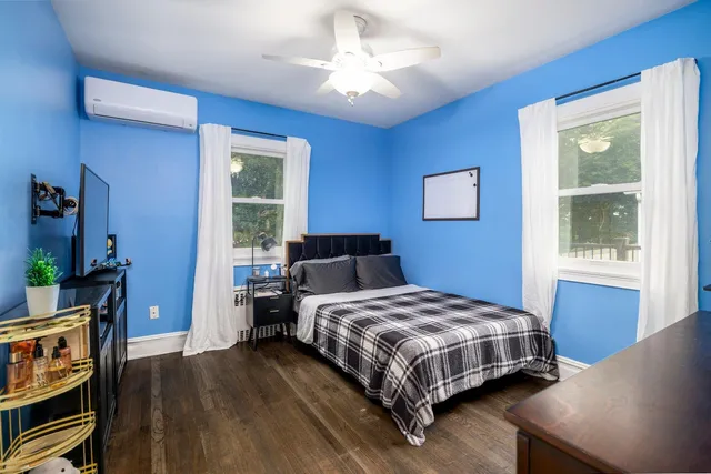 a bedroom with a bed and a desk