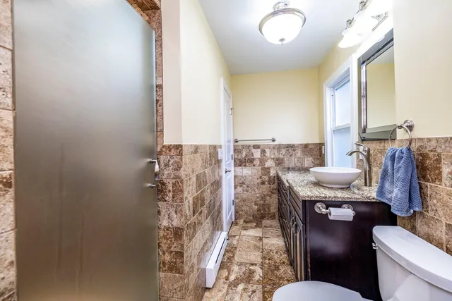 a bathroom with a mirror and a shower