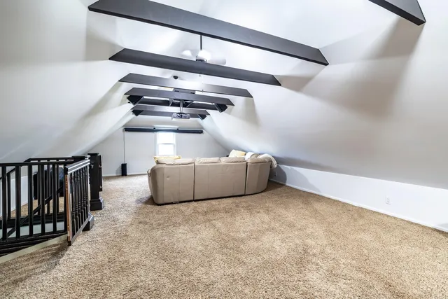a bathroom with a granite countertop toilet sink and mirror