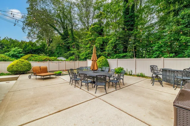 an outdoor space with furniture and garden