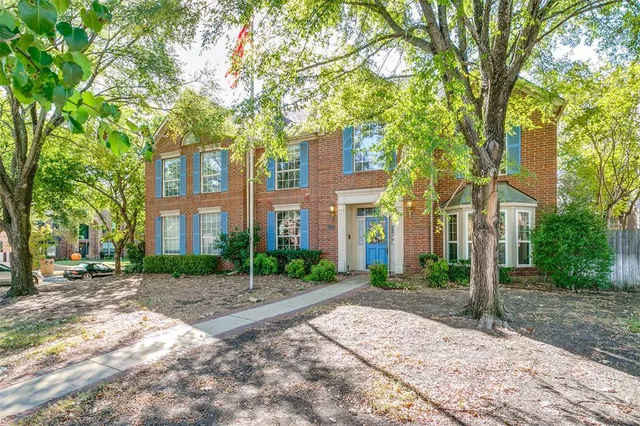a view of a building with a tree