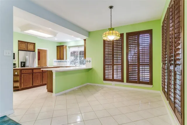 a view of a kitchen with a sink and a large window