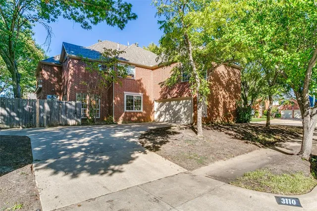 a view of a house with a tree