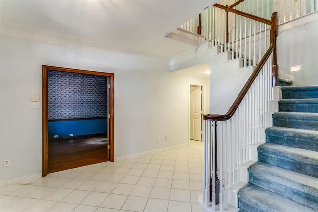 a view of entryway and hall with a door