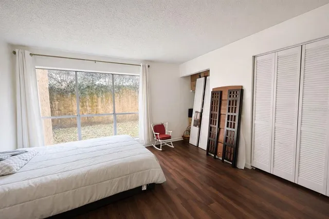 a bed room with a bed and a lamp