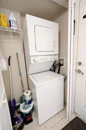 a view of a balcony with chair and table
