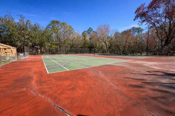 a view of a swimming pool with an outdoor seating