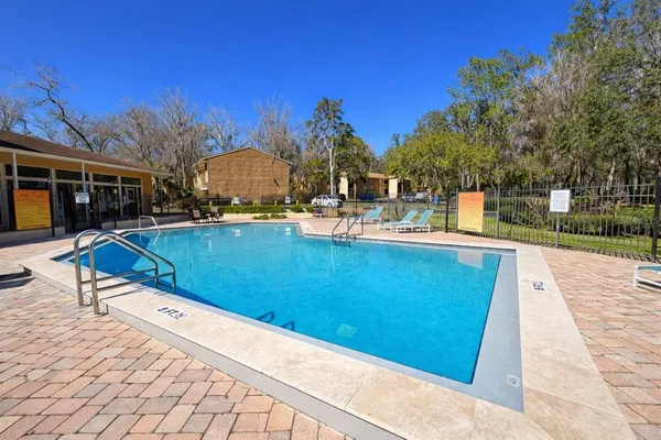 a view of a living room and workspace