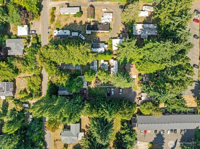 an aerial view of residential houses with outdoor space